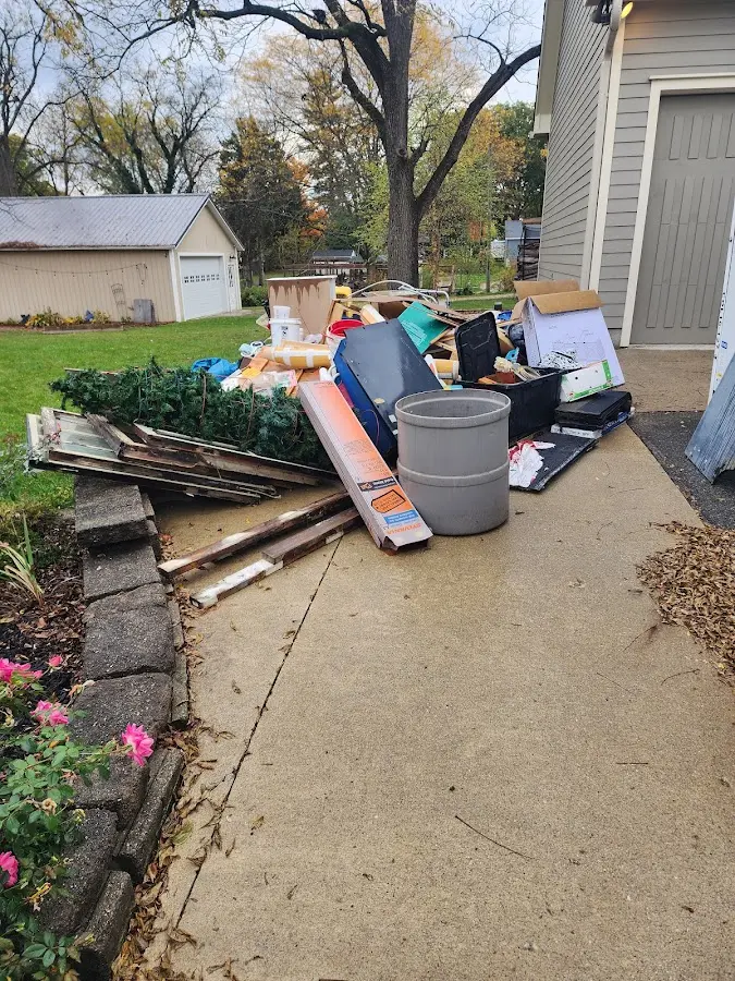 Dumpster being loaded with debris for Estate Cleanout Dumpster Rental in Mifflinburg
